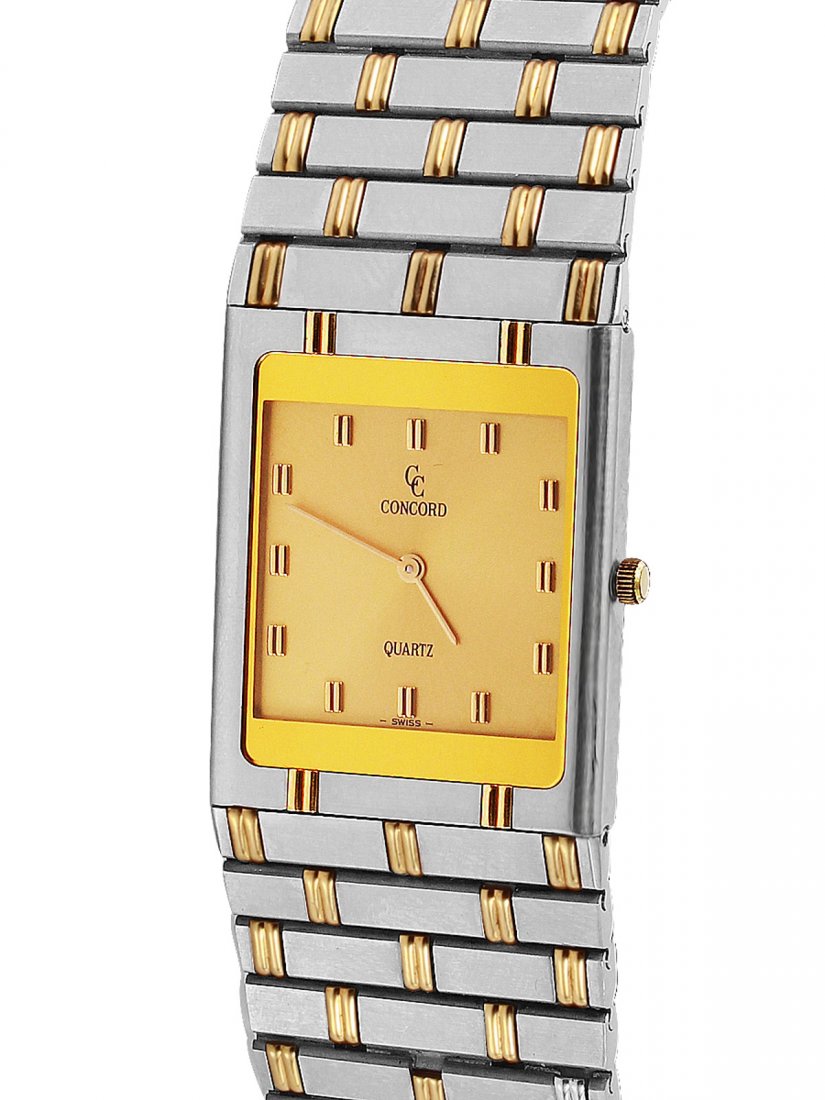 Concord 18KT Gold and Steel Men's Dress Watch Ref:: Concord 18KT yellow gold and stainless steel Men's dress watch. Quartz movement, case 29mm 24mm x 4mm. Case number 664080. Champagne dial with double baton markers and baton hands. 18KT yellow gold an
