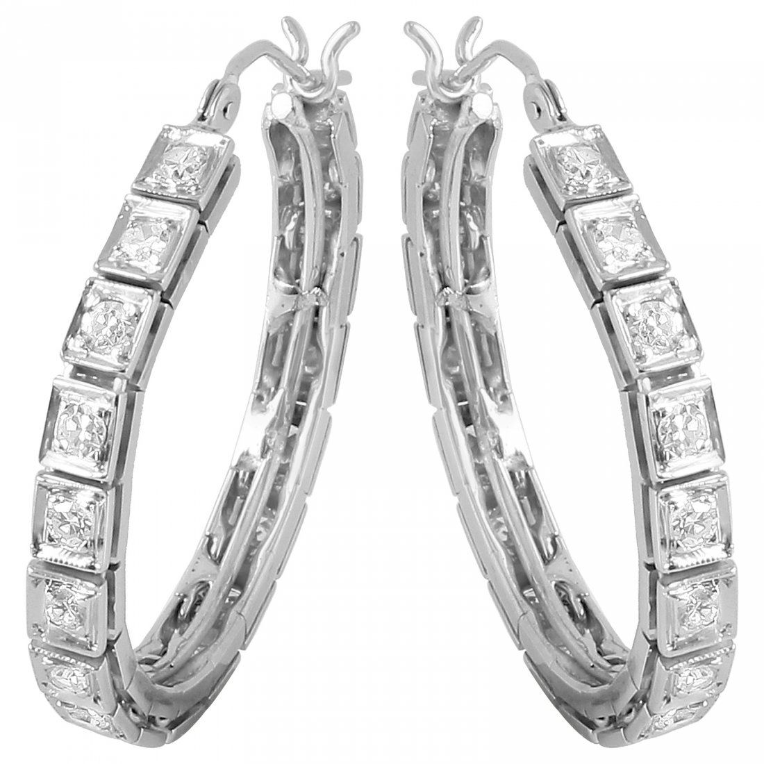 14KT White Gold Diamond Hoop Earrings: Round single cut diamonds are prong set from end to end on these brightly polished 14KT white gold hoop earrings. The curved post click tops snap shut, so the hoop will lay properly when worn. Specifi