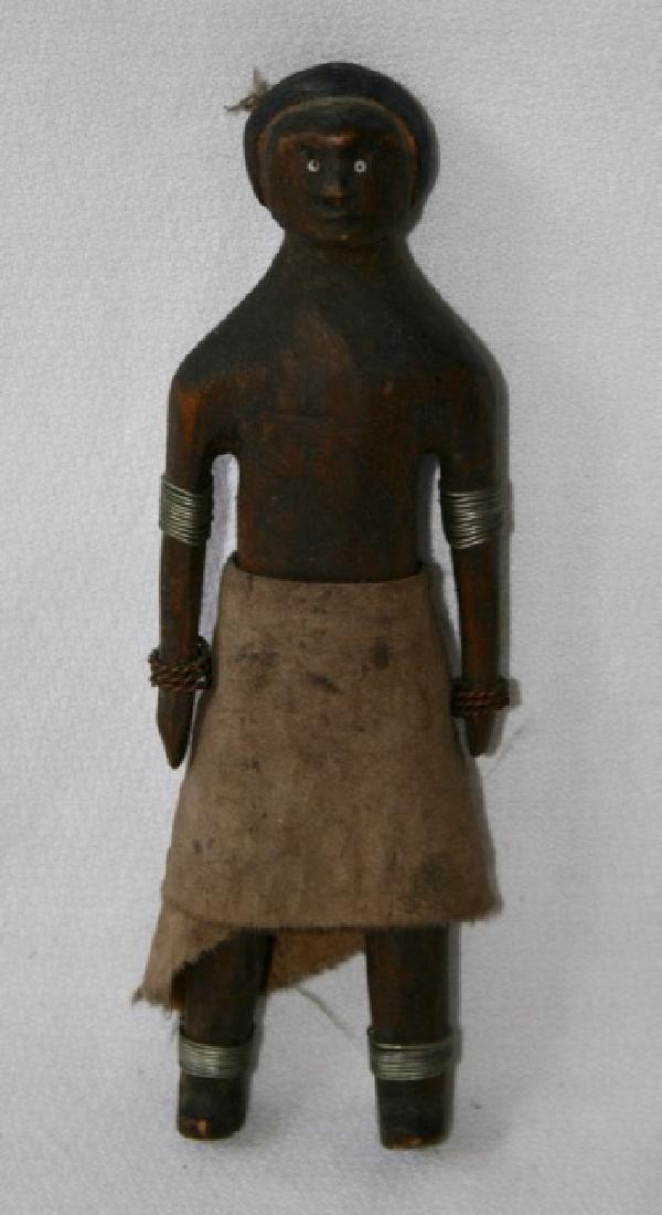 African Carved Wooden Doll Figure: Cloth skirt. Wire anklets. 7 1/2"H.