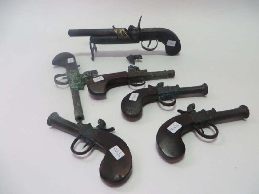 Gun Model Lot . Iron and Wood (6): Varying Sizes. Iron and wood. Six in the lot . Largest gun part off. Part included in the lot. 10"L. t0 6 1/4"L