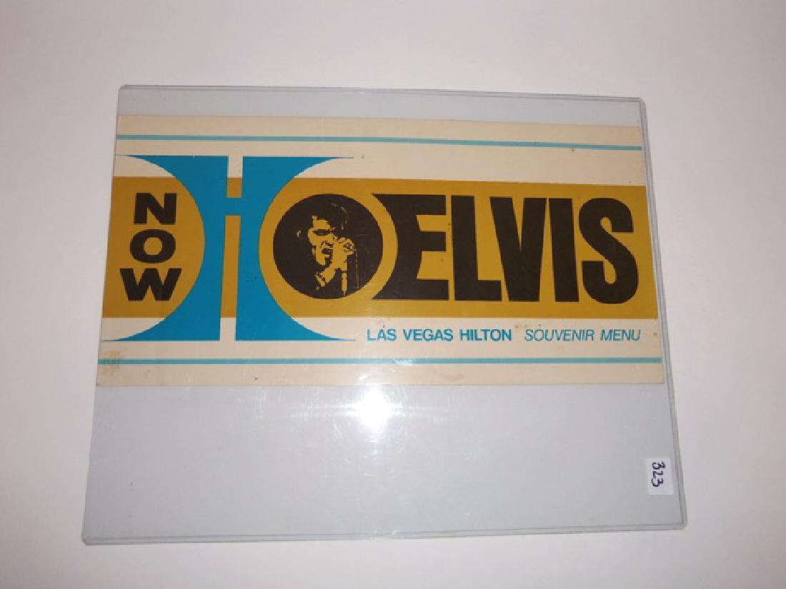 Elvis Las Vegas Hilton Souvenir Menu: Champagne, wine and dinner menu for the Las Vegas Hilton with Now Elvis and photo of The King on the cover. And Elvis's Latest Albums advertised on the backside as well as his MGM movie, Elvis on Tour