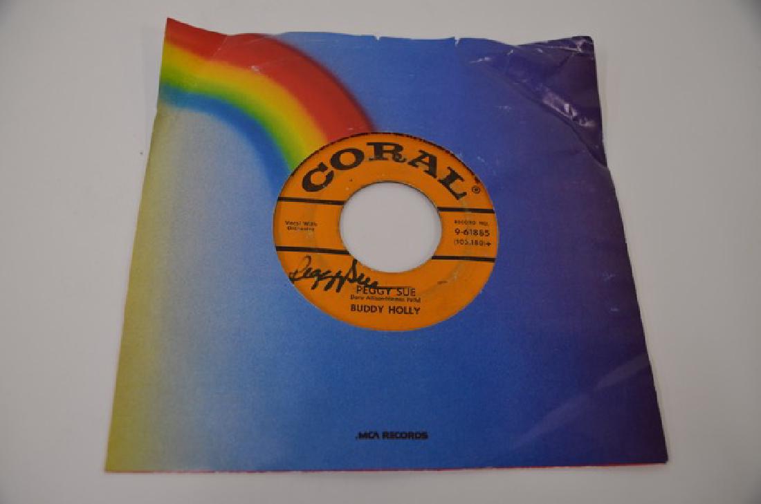 Coral Record Peggy Sue Signed: No. 9-61885. On the reverse side Everyday. '45's
