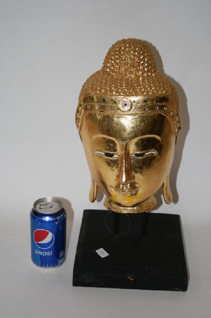 Burmese Antique Re-Gilded Carved Buddha Head: Carved wood on stand.Â Re-gilded in the tradition.Â 15"H