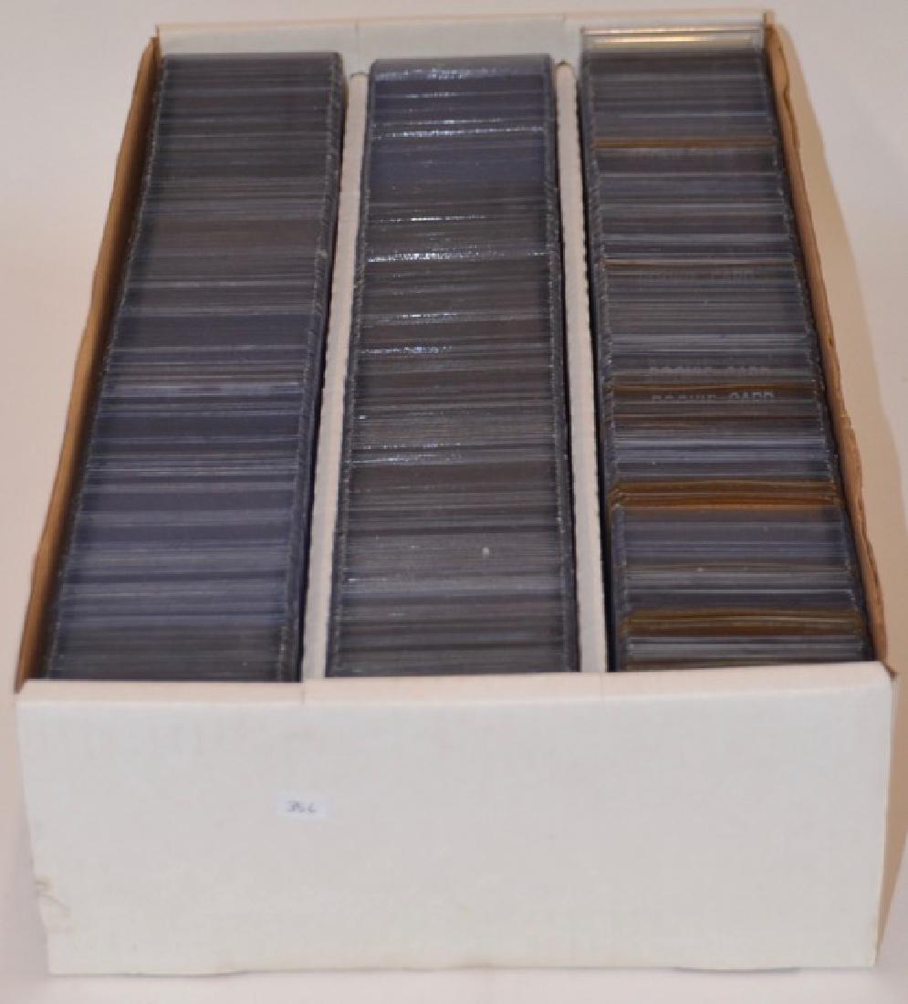 1980's- 1990's Mixed Sports Cards (600): All cards are in protective sleeves and in good to excellent protected condition. NFL and NBA as well as NHL sports cards included. Multiple Rookie cards include Ellis Johnson, Kevin Lee, Vin Bake and