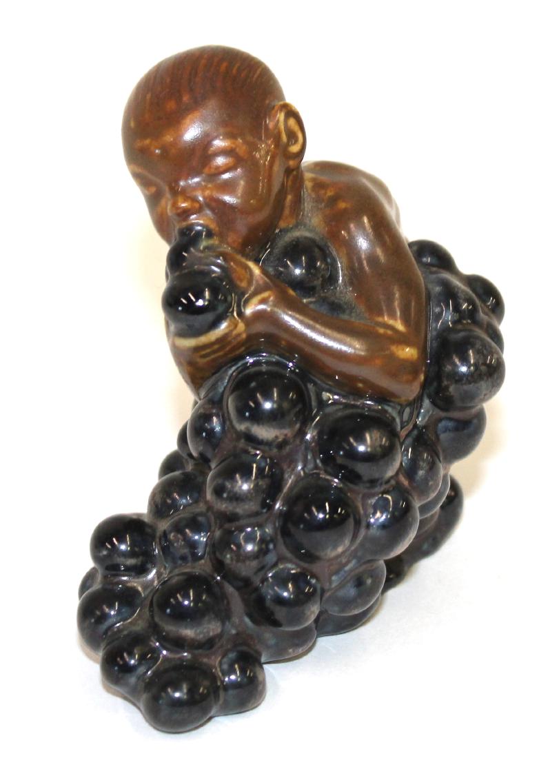 Bing & Grondahl Figure. Baby Figure Eating Grapes: Artist signed Kai Nielsen. 1912. Numbered -18 3 1/2"H.