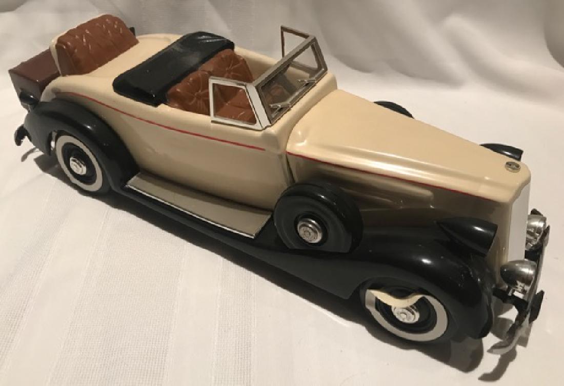 McCormick's Classic Car, 1937: Limited Ediition, 1st of a Series. White walls on tires are loosing their adhesion. Black and cream with red strip and brown leather. 17" long