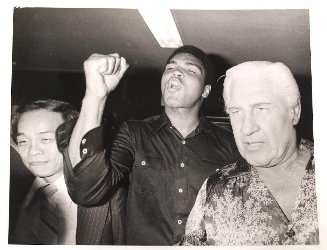 Nikkan Sports Origiinal News Photo. Muhammed Ali: Nikkan Sports Original News Photo of Muhammed Ali. With a stamp at the back The Nikkan Sports News Photo. Nikkan Sports News was the first launched Japanese daily sports newspaper founded in 1946. 8 x