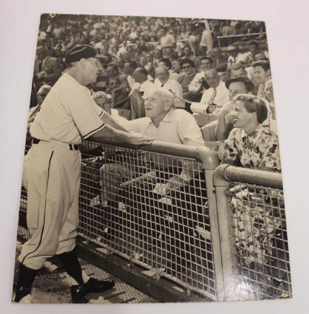 Leo Durocher. Laraine Day Photograph: An elderly Leo Durocher in the stands with Laraine Day being greeted at the ballpark. 10 x 11 1/2