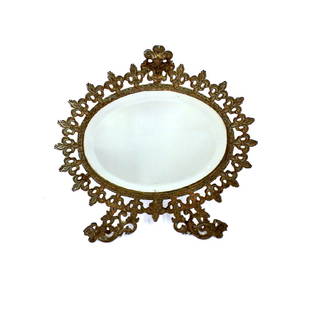 Fancy Victorian Brass Openwork Mirror: Easel back Victorian Dressing Table Mirror. Ornate openwork frame with beveled mirror. 11"H. x 10 1/2"W.