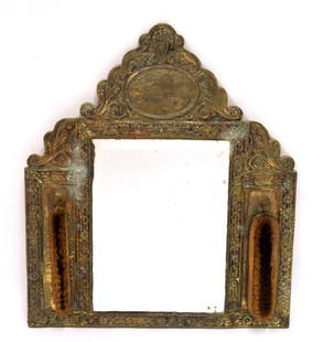 Victorian Gentleman's Brass Mirror: Ornate bas releif gentleman's mirror with brush at either side. Wood backing. 20"H. x 17 1/2"W.