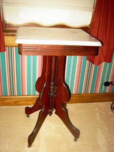 Victorian Mahogany Marble Top Table: On castors. 29 1/2"H. Marble top is 15 1/4"D. x 17 1/2"W