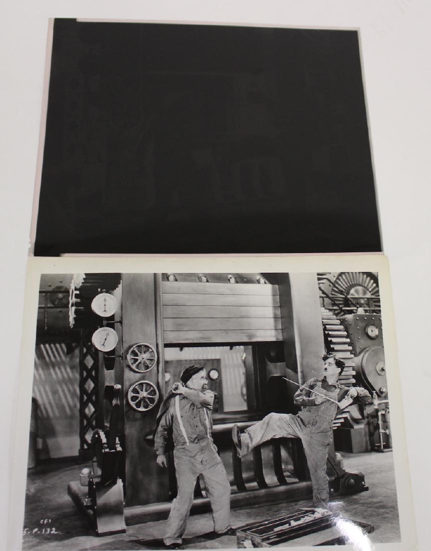 Vintage Still. Charlie Chaplin. For Modern Times: With back stamp for Modern Times with Paulette Goddard and Chester Conklin by Lopert Film. With the negative from which it was made. 8 x 10