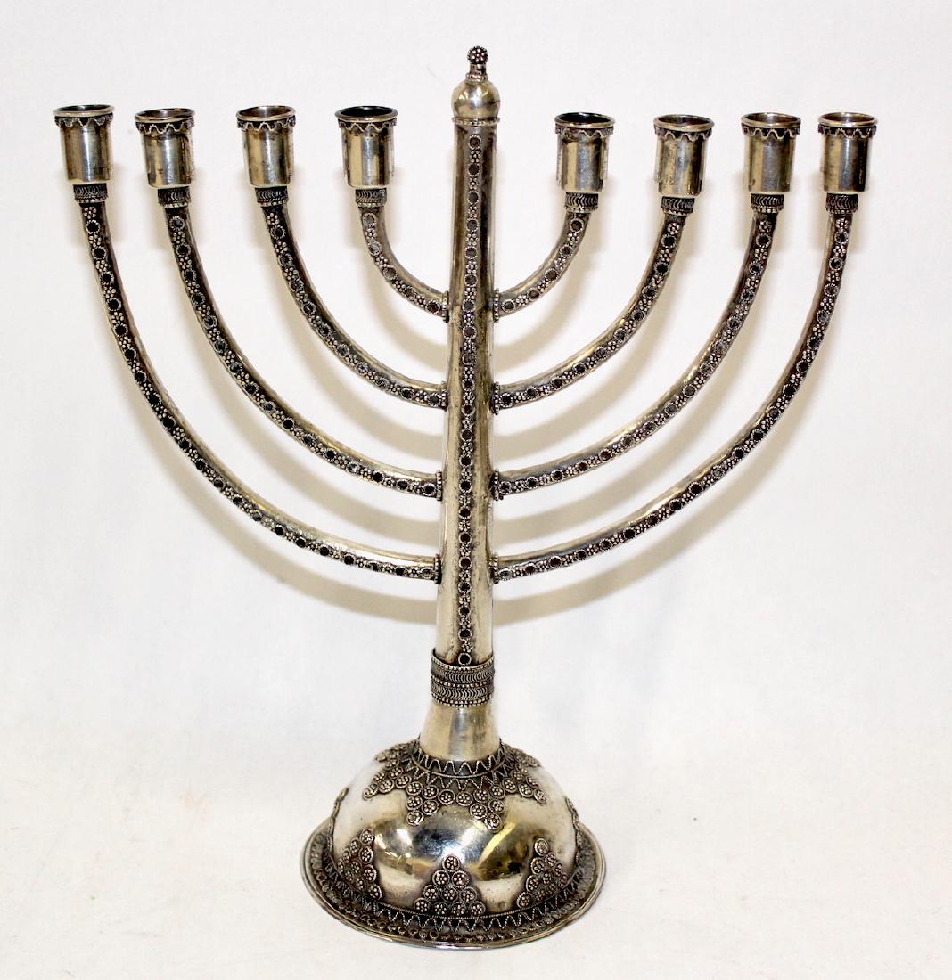 Sterling Silver Menorah: Ornately decorated sterling silver menorah. 6.5 troy ounces. 10"H.