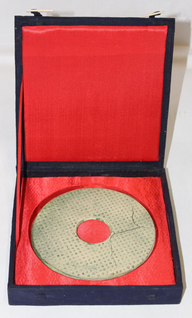 Another rarity of excavated Han Dynasty glass: A safe cushioned box has been built for this due to its fragile nature. To simulate jade, a nice size green glass version of a jade Pi, or Bi. Probably accomplished by way of a wood carved mold, the b