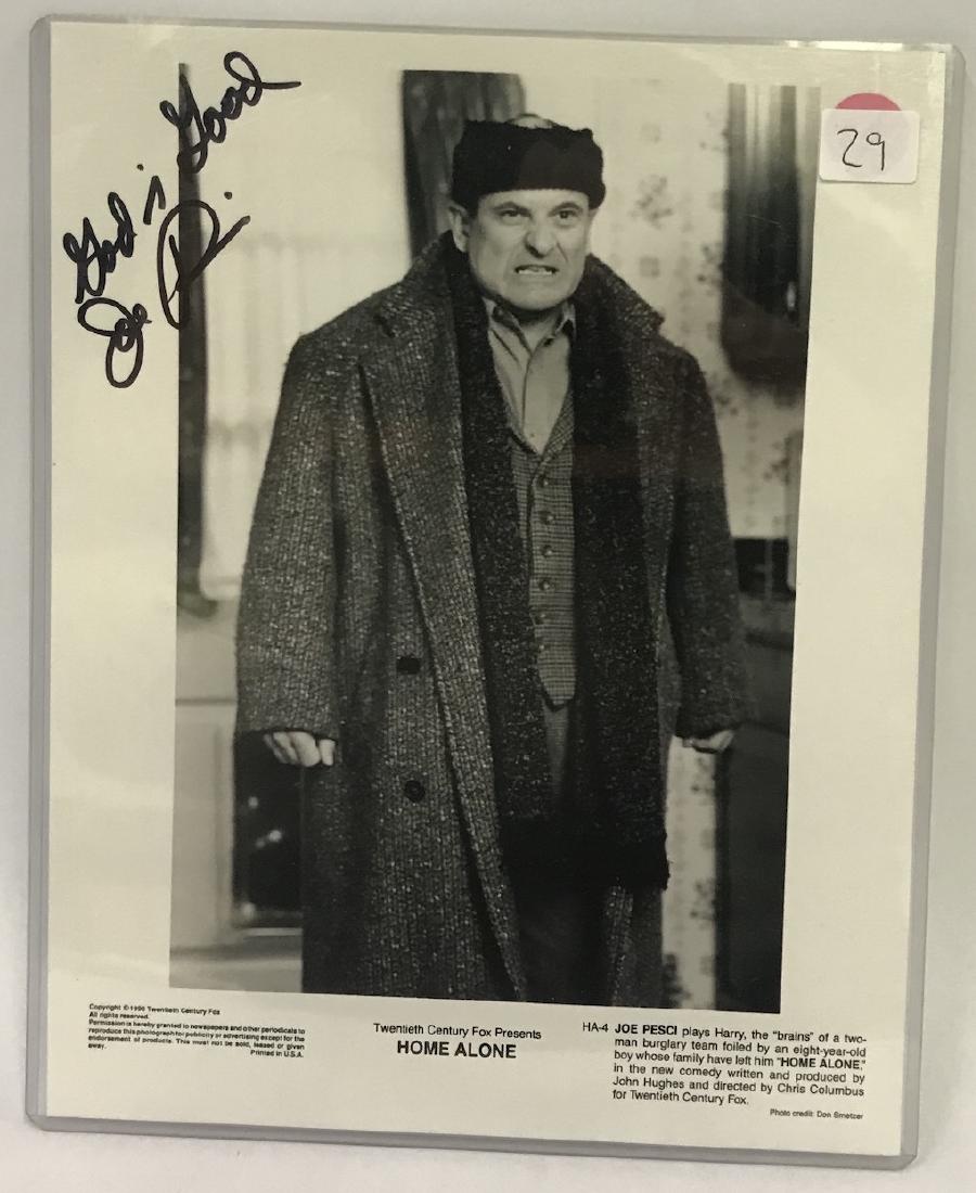 Joe Pesci Autographed Photograph: In bold black soft felt pen. God is Good Joe Pesci on a publicity photo for 20th C. Fox's Home Alone