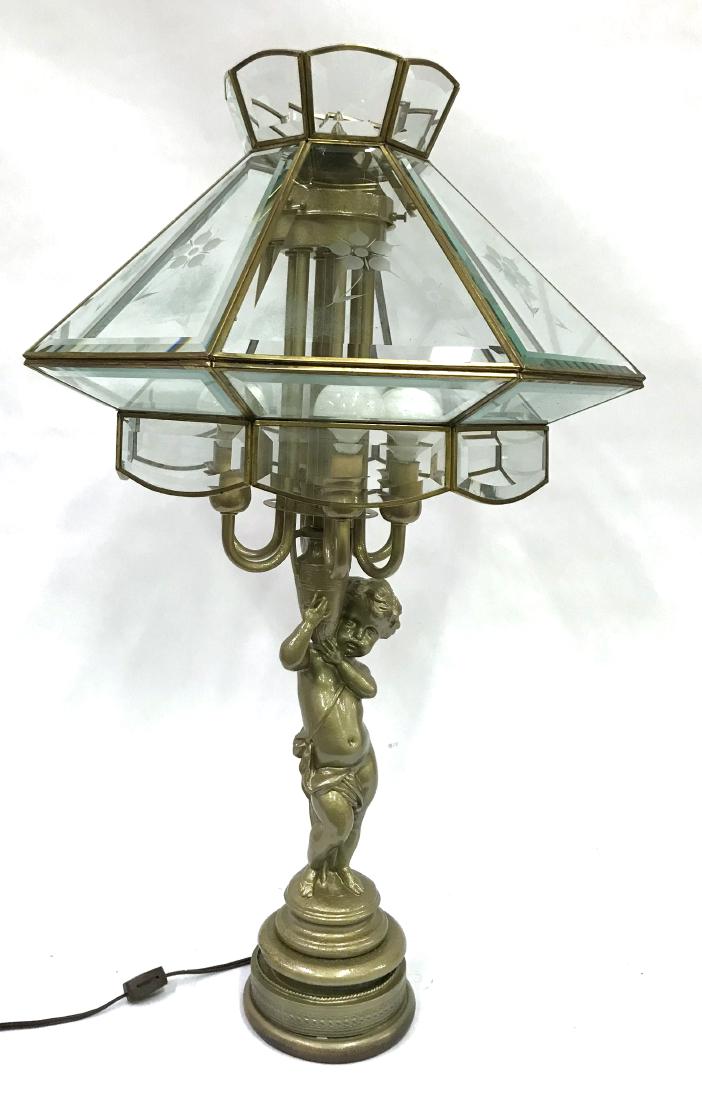 Vintage Lamp. Silvered Cherub Base. Leaded Shade: Eight beveled glass panels with etched floral decoration. Six lite candleabra lite section being held up by the cherub. 28"H. 18 1/2" D shade.