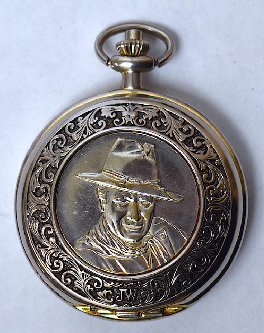 John Wayne Collector's Hunting Case Pocket Watch: Portrait of John Wayne on the front with highly repoussed band. Marked JW on the dial. Marked Franklin Mint Collector's Watch at the back. Impressive oversize. 2 1/2"W with considerable depth.