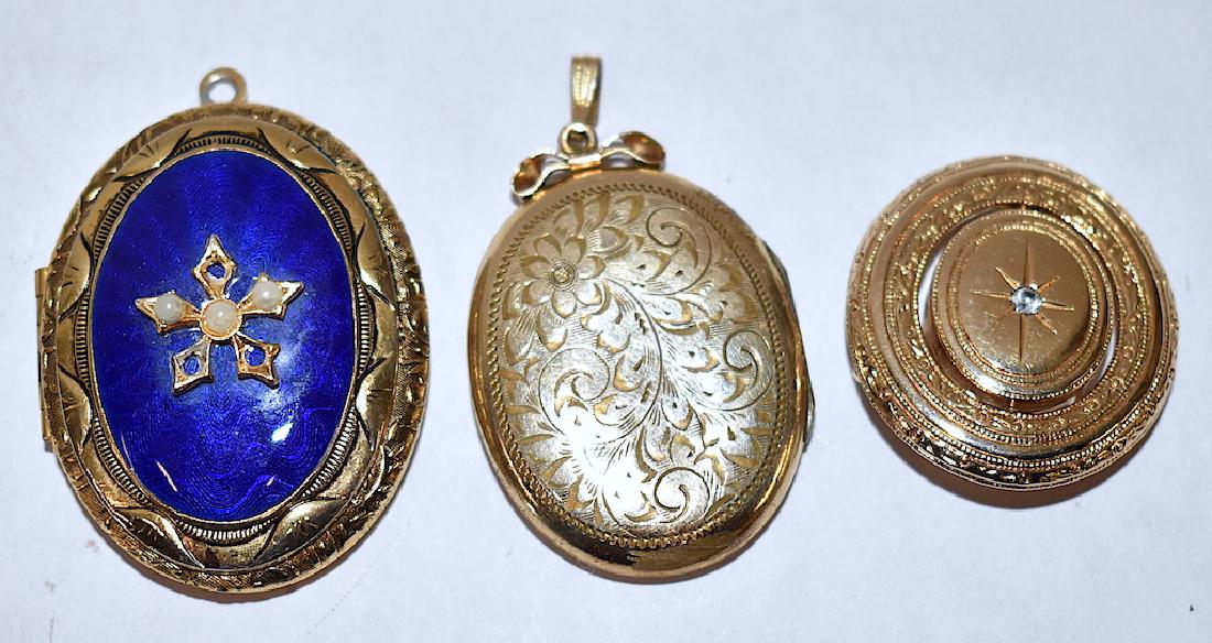 Victorian Lockets (2) and Vintage Brooch.(3 items): Circular brooch with an indiscernible marking, oval locket opens to hold photo, enameled fancy oval Victorian locket missing three seed pearls on front mount. Three vintage pcs. of jewelry in the lot.