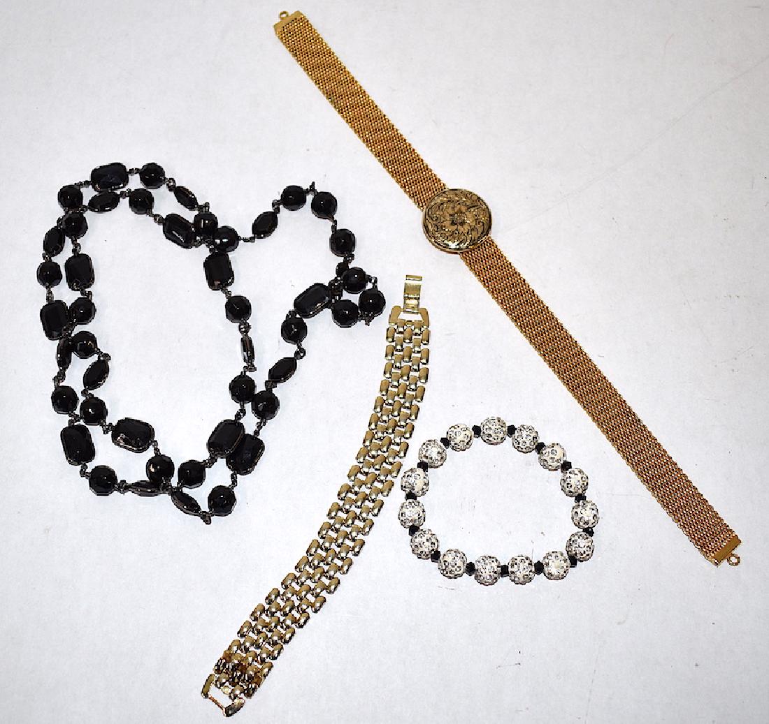 Collectors Lot of Vintage Jewelry (4): Gold filled mesh bracelet; mesh choker with circular embossed centralized medallion; a black jet bead necklace and an expansion rhinestone bracelet. 11" choker, 34" jet bead necklace. Four items in th