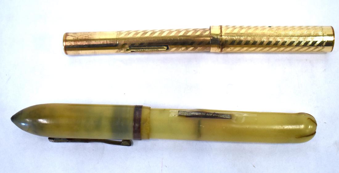 Manhattan Pen With Bakelite Fountain Pen (2): Manhattan Original Fountain Pen marked Manhattan on the ink filler and on the clip (has been converted to ball point) and a Bakelite Royal fountain pen with an 18K Goldplated nib ( as is) Damage will