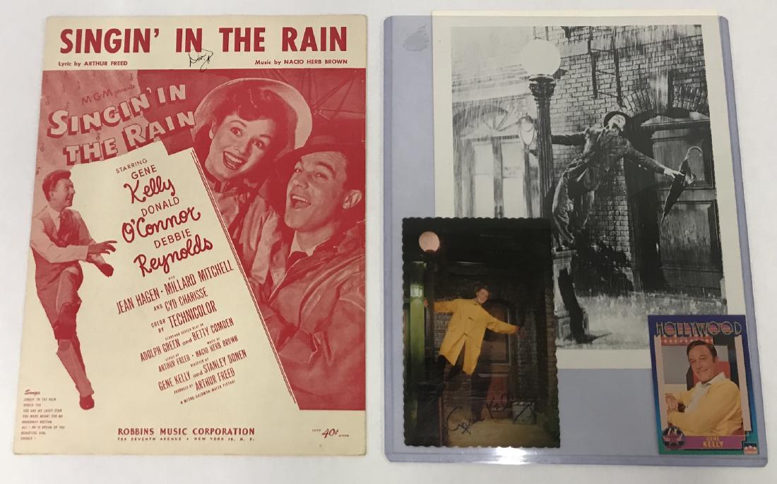 Donald O'Connor Singing in the Rain Sheet Music: Signed in ink at the top. The lot includes a Gene Kelly postcard.