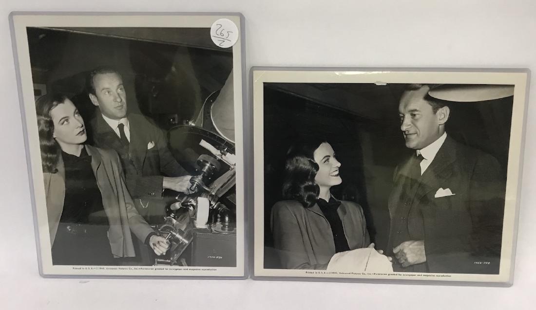 1945 Universal Pictures Photos. George Sanders: With Ella Raines on set. C. 1945, both with studio and date printing at the bottom margin 8 x 10