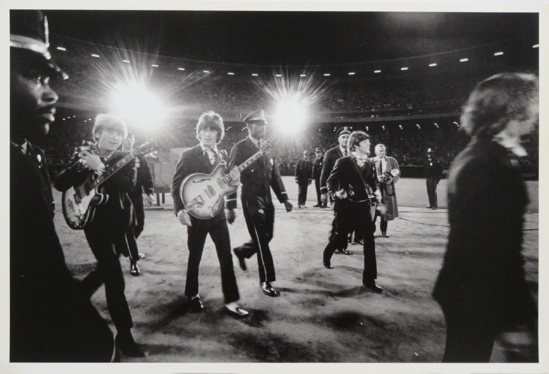 Beatles 1966 US Tour 3 Jim Marshall Photo: The photograph measures 17.5x11.5 and is printed on double weight photographic paper and was printed in the late 1970's. It comes stamped by the photographer with other press details on the verso. In 