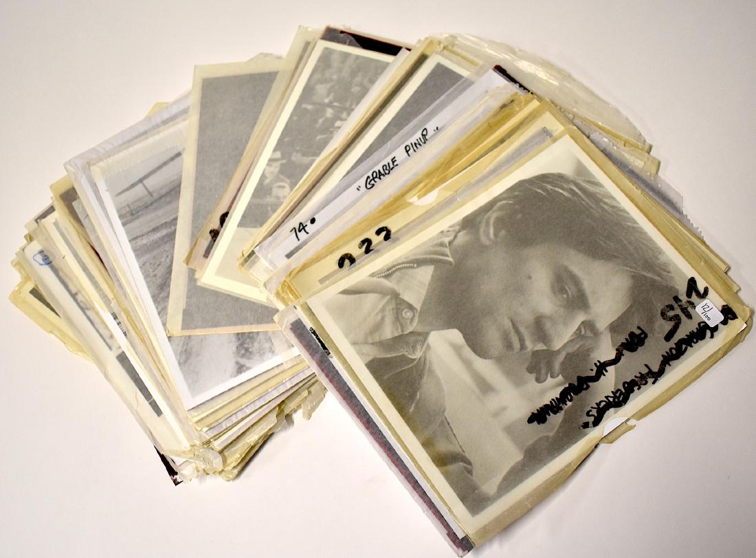 Photographs and Negatives (100): Included in the lot are Paul Newman photos and negatives (many including with Piper Laurie in The Hustler); Cary Grant photos and negatives; Betty Grable, early glamour portraits and a bathing suit pi