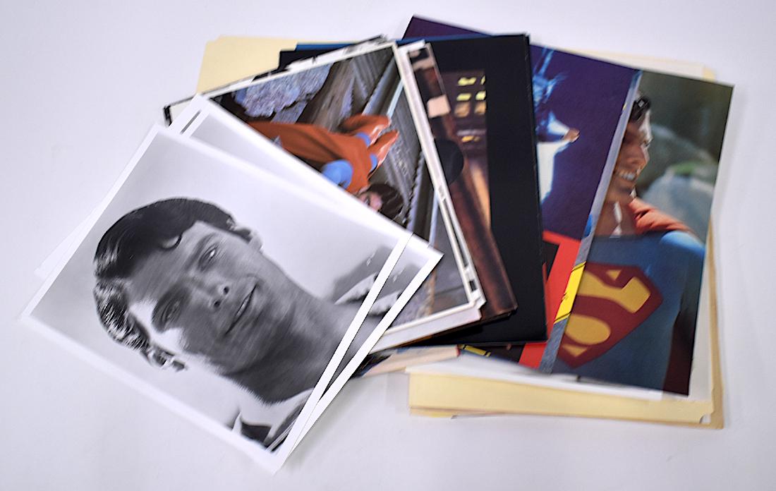 Superman , Superman II and Superman III Photos (39): Collectors lot. Folders of memorabilia. Superman, 18 photogjraphs with several newspaper articles regarding the film; Superman II, 8 photographs with news articles re: the film and Superman III , 13 p