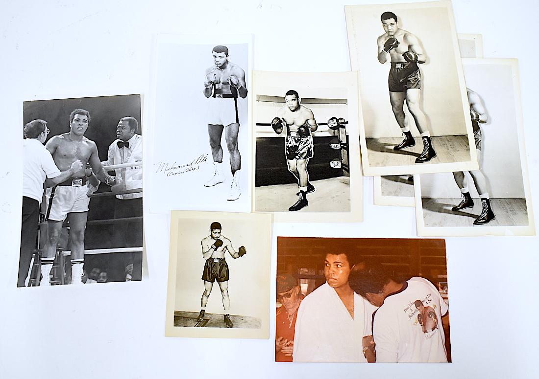 Boxing Photographs. Ali, Joe Louis, Publicity and: Included in the lot is a snapshot of Ali being treated by an assistant in a "Float Like a Butterly Sting Like a Bee" robe; Ali in the ring with Bundini; a giveaway promotiion with Ali in boxing stance