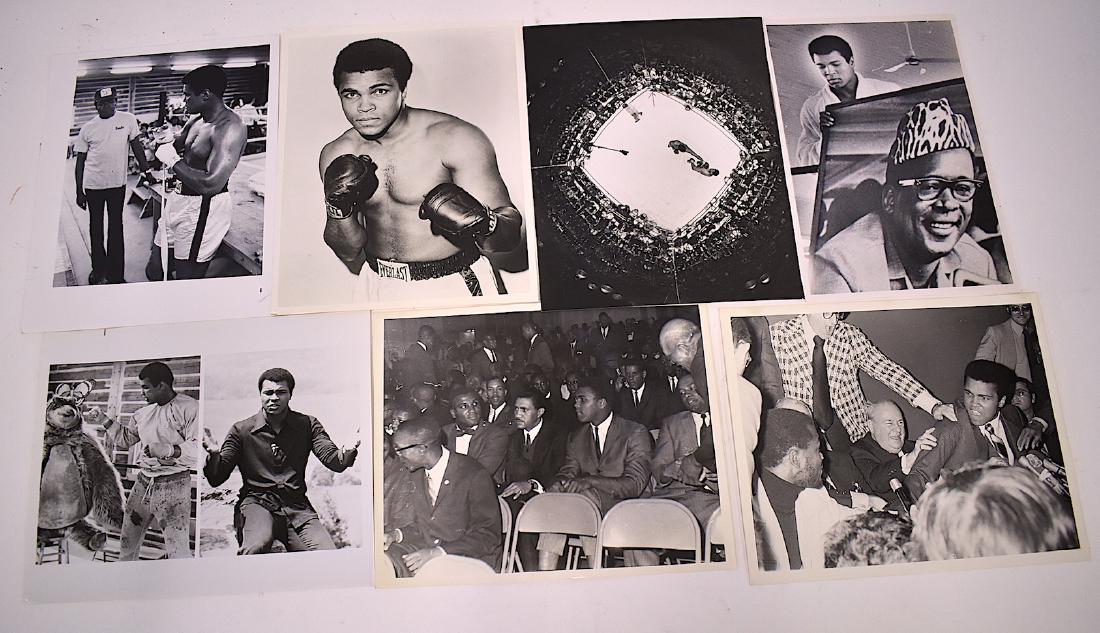 Muhammad Ali Sports Photographs ((7): One, a young Ali with a back stamp for Alfred X. Cabey (All rights reserved); one with Bundini. all in good to excellent condition except one with crease hard to see. Seven in the lot. All 8 x 10 exce