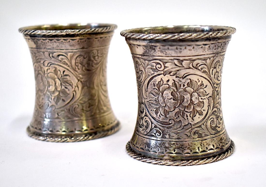 Pr. Unusual Large Sterling Silver Napkin Rings.: With brite cut engravings. Unmarked but guaranteed sterling. 4.20 troy ounces. 2 1/2"H.