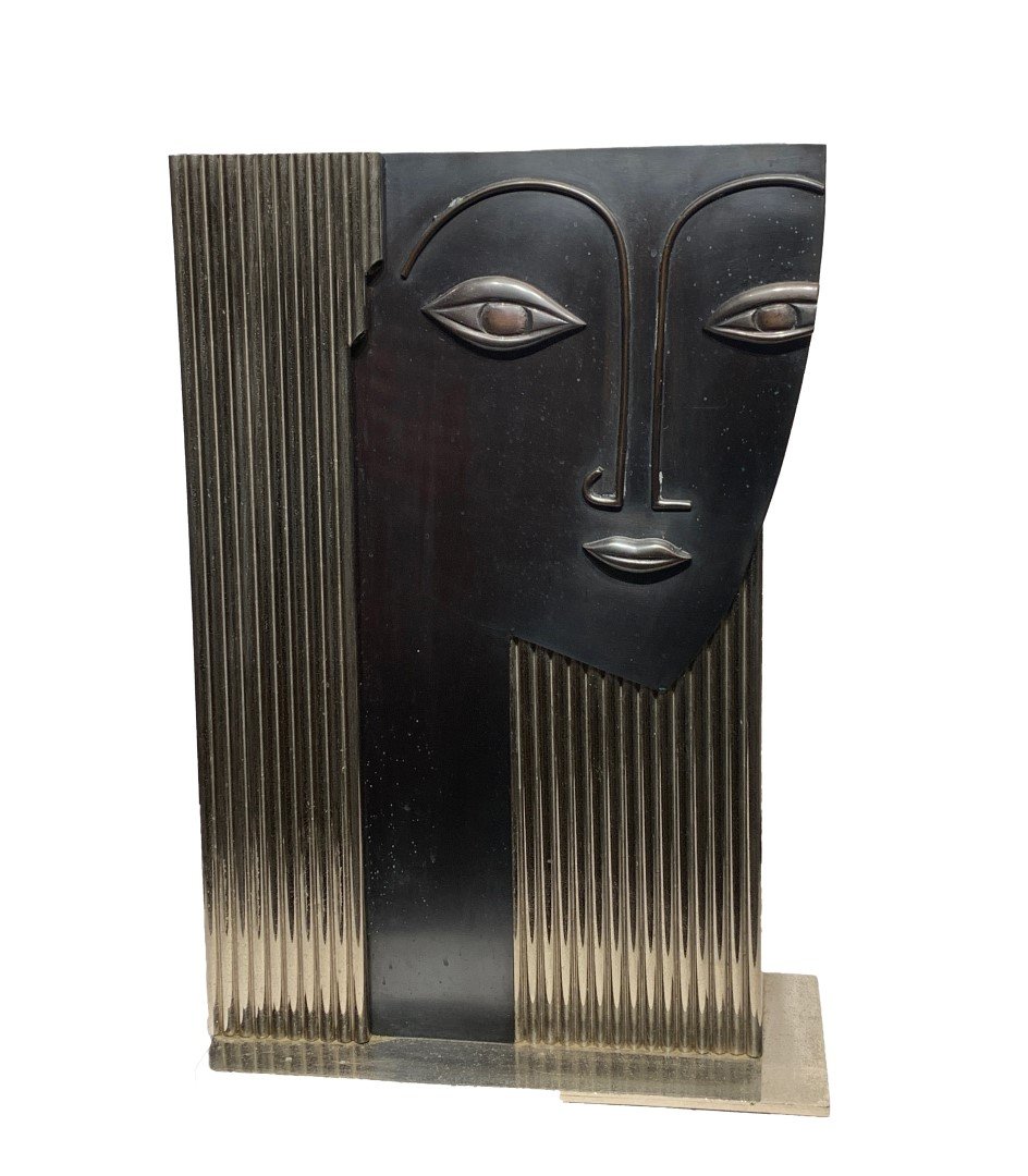 Franz Hagenauer Style Art Deco Silvered Umbrella Stand: Art Deco silvered brass and metal umbrella stand. Depicting the stylized head of a woman. In the manner of Hagenauer; 20.5in.H. X 13.75in.W. X 6in.D.