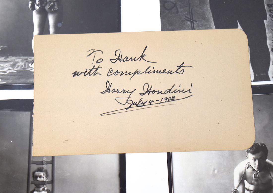 Harry Houdini Autograph. On an Album Page.: Signed in ink on an album page, "To Hank With Compliments Harry Houdini" This signature was obtained in person on July 4, 1908. Harry Houdini (1874-1926) Framed with four photographs of Houdini. 4" x