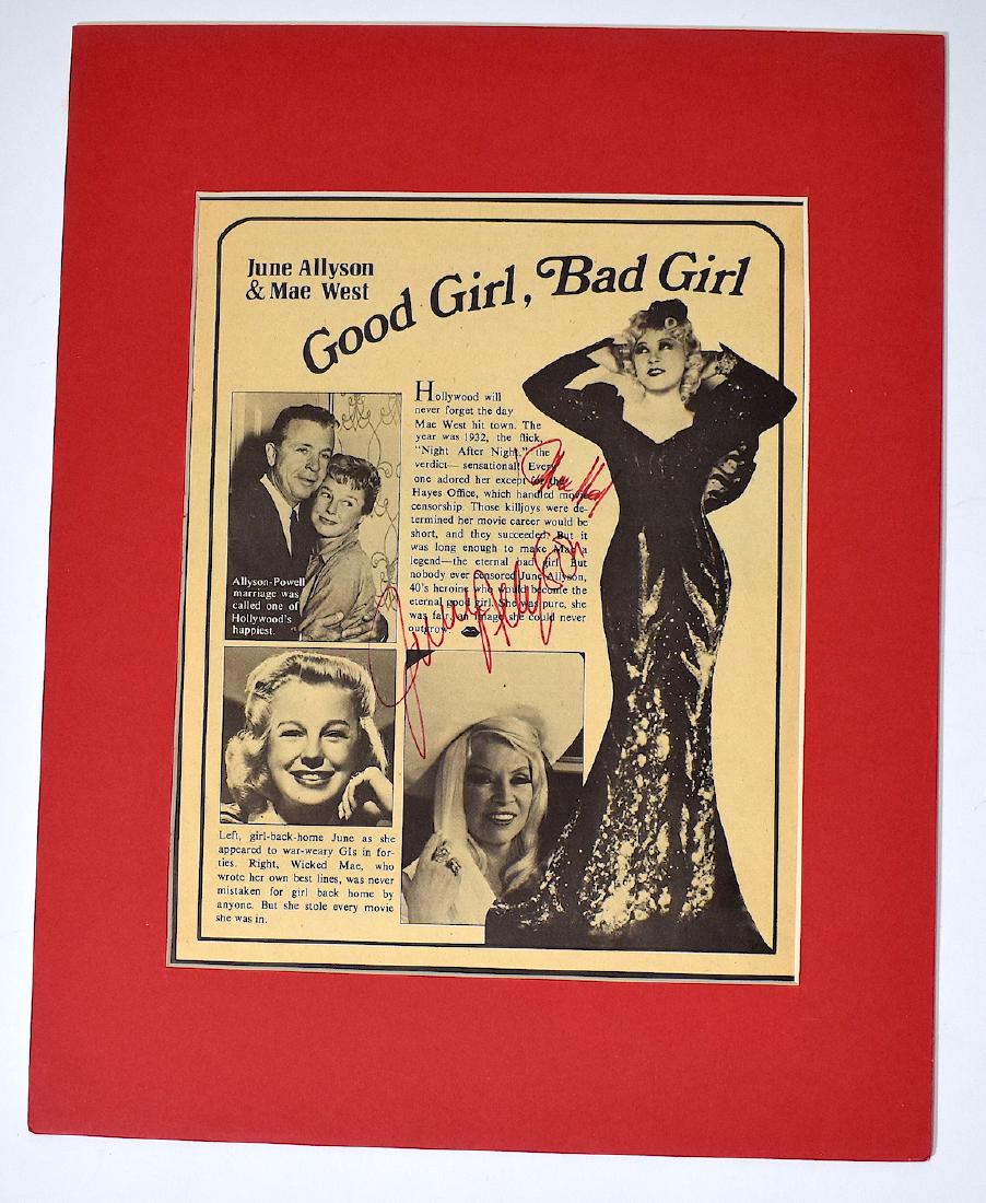 Mae West and June Allyson Autographs: Both signed in red ink on newspaper ad for "Good Girl, Bad Girl" Housed in a display case. 14" x 11"
