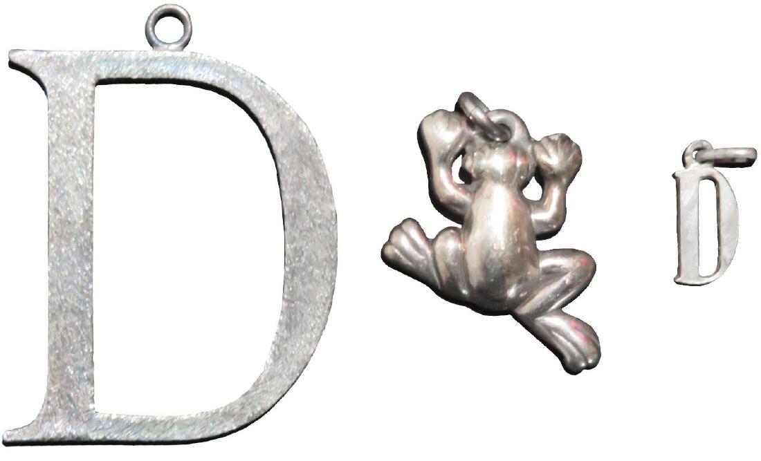 Princess Diana 2 Sterling Silver Letter "D" & Frog: Lady Diana was known for wearing the first letter of her name, the letter "D" and these 2 letter D's were found inside a Harrods handbag with a sterling silver frog. One of the letter D's is large wit
