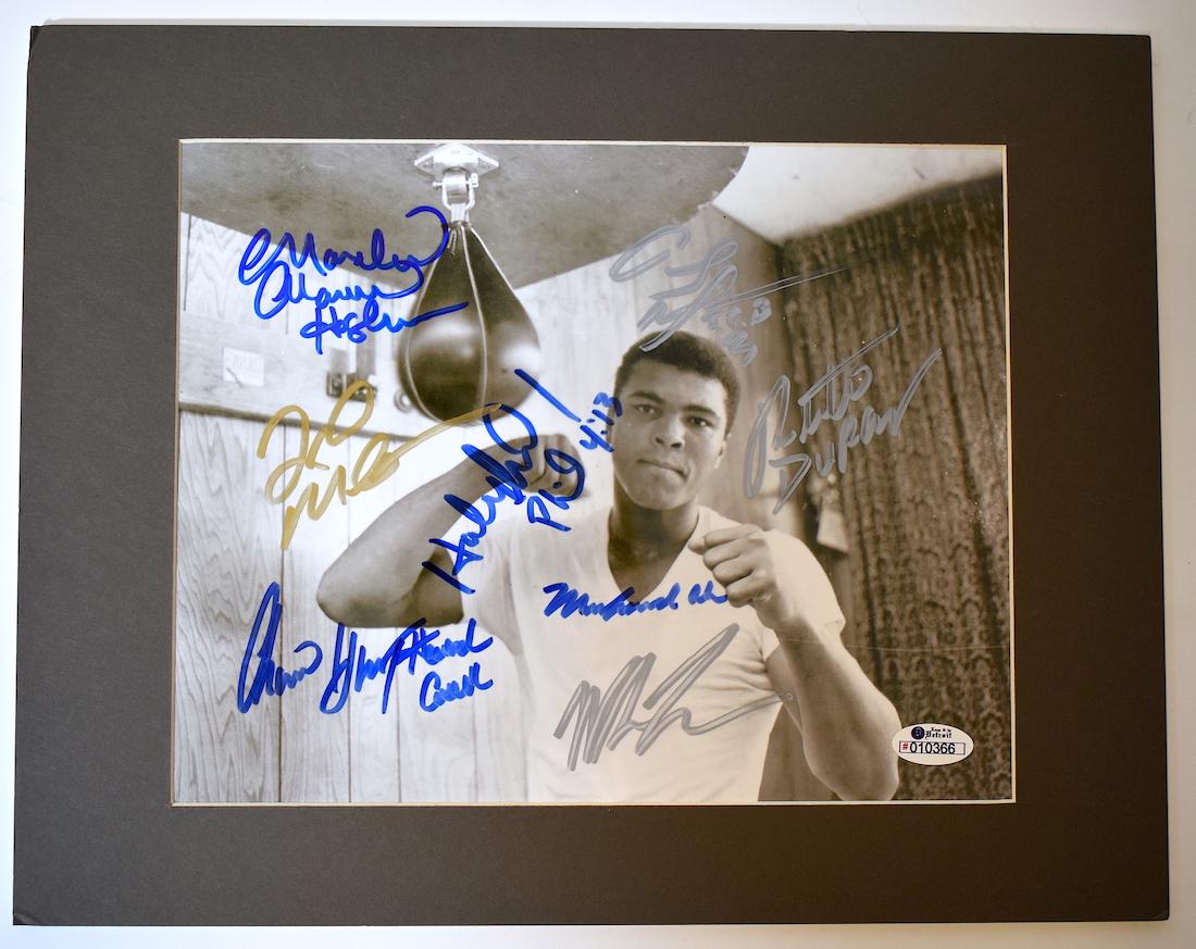 Boxing Greats Autographed Photograph: Signed by Muhammed Ali; Evander Holyfield; Mike Tyson; Marvin Hagler; Floyd Merriweather Jr.; Tommy Morrison; Roberto Durand; Thomas Hennessy and Howard Cosell. . Matted.