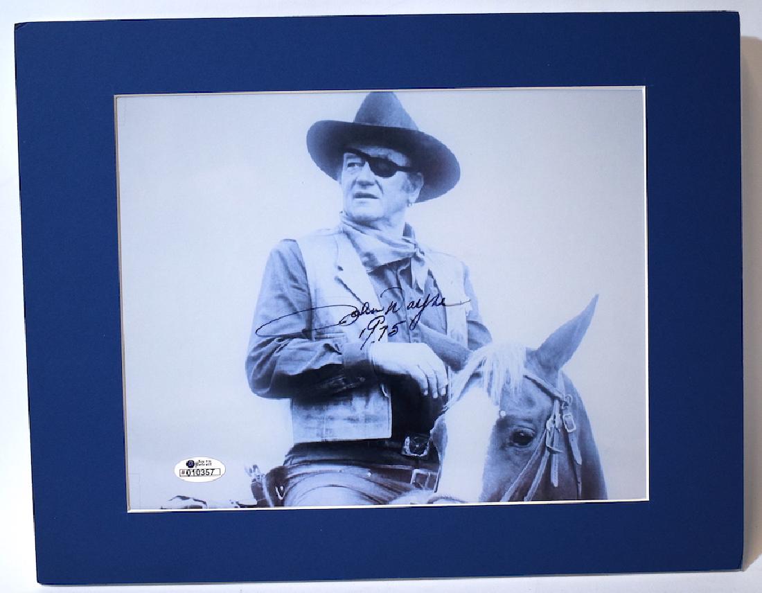 John Wayne Autographed Photograph: Signed John Wayne 1975 in ink. With certificate at the back by Keep it in Detroit. Matted.