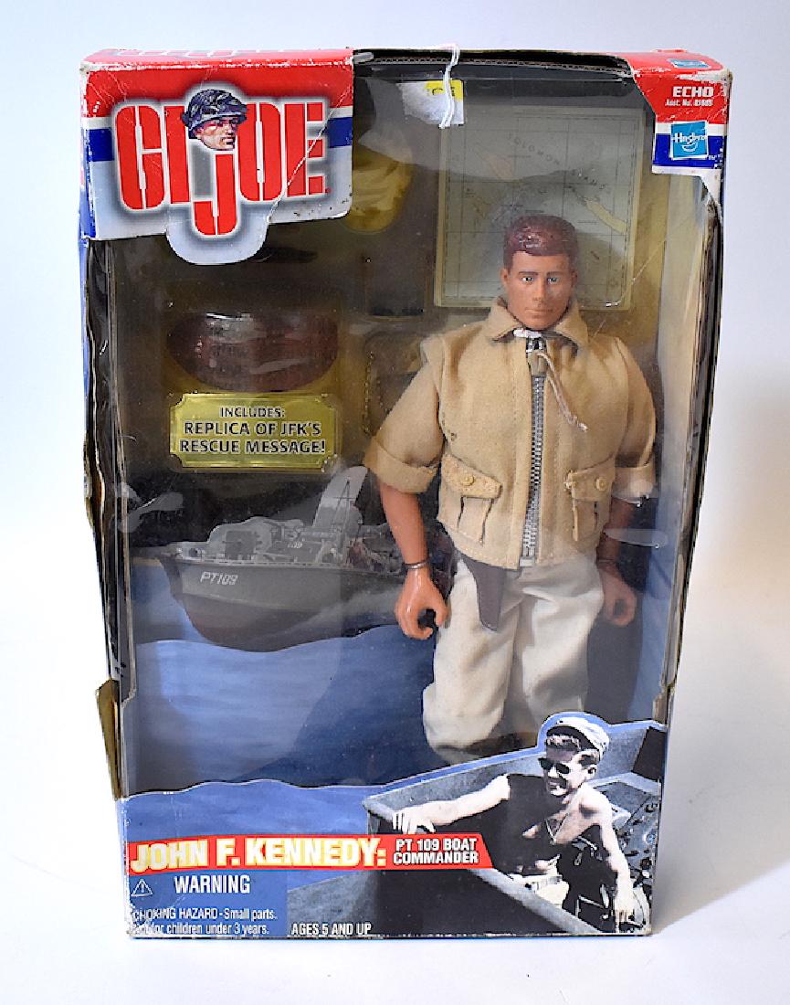 John F. Kennedy PT109 Boat Commander Doll: Made by G.I. Joe. Includes ,in additiion to the doll, a repica of the PT Boat and a replica of JFK's rescue message. Never out of the box but box is well worn. 2000 by Hasbro with the history of JFK a
