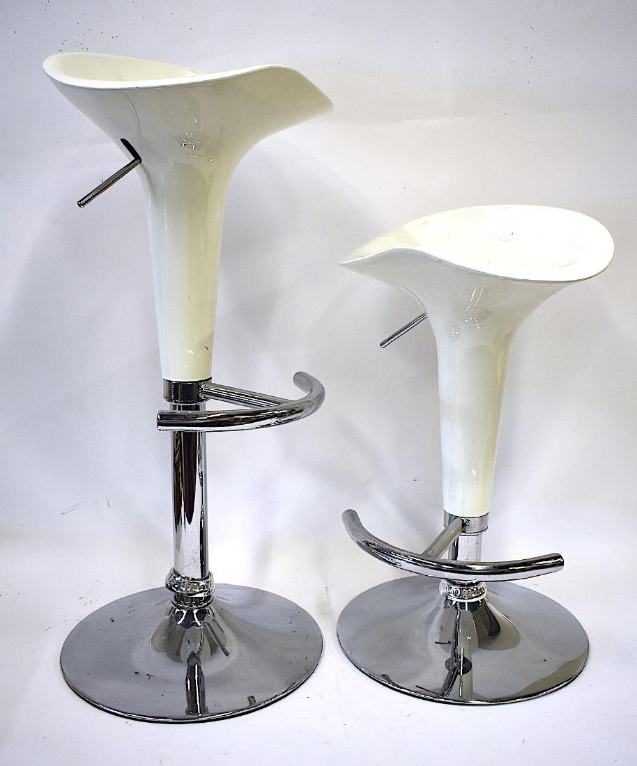 Pr. Mid-Century Modern Modern Adjustable Stools: Chrome bases. 25"H. Adjusting to maximum height of 34"H. Seat 15"W