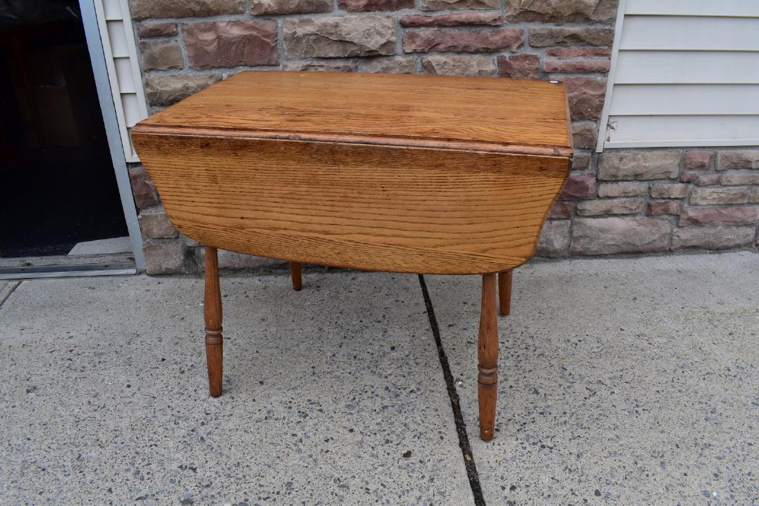 Victorian Oak Drop Leaf Table: Carved oak drop leaf table; 30in.H. x 36in.W. x 22in.D. x 42in.(opened)