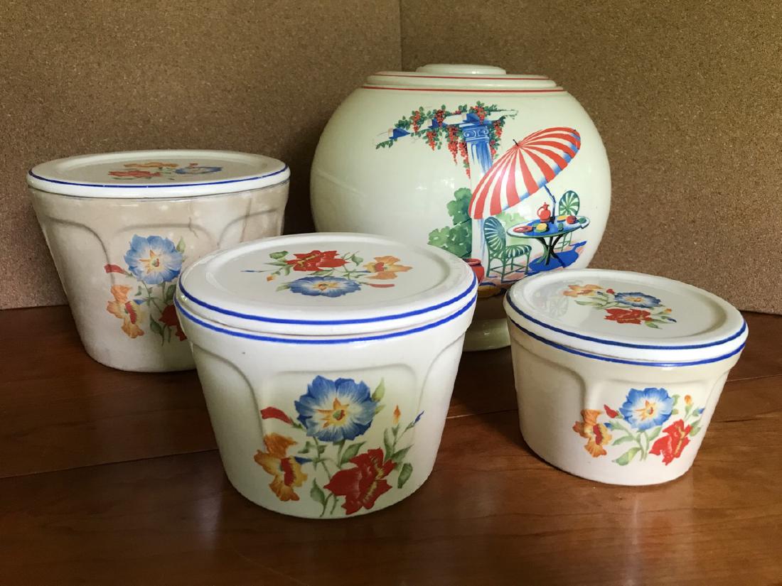 Universal Cambridge Nesting Bowls and Cookie Jar: Universal Cambridge covered nesting bowls. Marked Made in the United States of America, Oven Proof. The largest bowl is somewhat discolored with age. Together with an unmarked Cookie Jar. Largest bowl