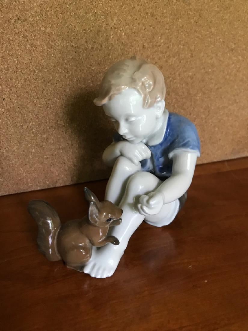 Rosenthal Boy with Squirrel Porcelain Figure: Marked at the base, Rosenthal Germany, 1663. 4-1/4" wide x 5" high