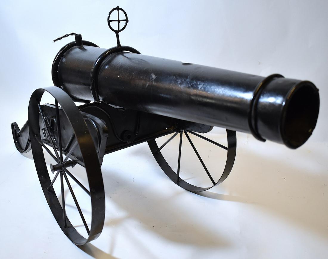 Black Metal Folk Art Toy Cannon: Rolling wheels. 18"H. x 36"L