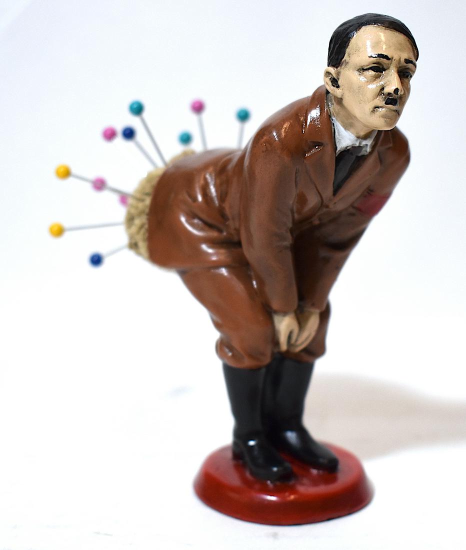 Most Unusual Hitler Pin Cushion: Speaks for itself. Polychromed bronze or iron Hitler pin cushion .Well detailed facial features and "brown jacket" uniform with symbol on sleeve. 5"H