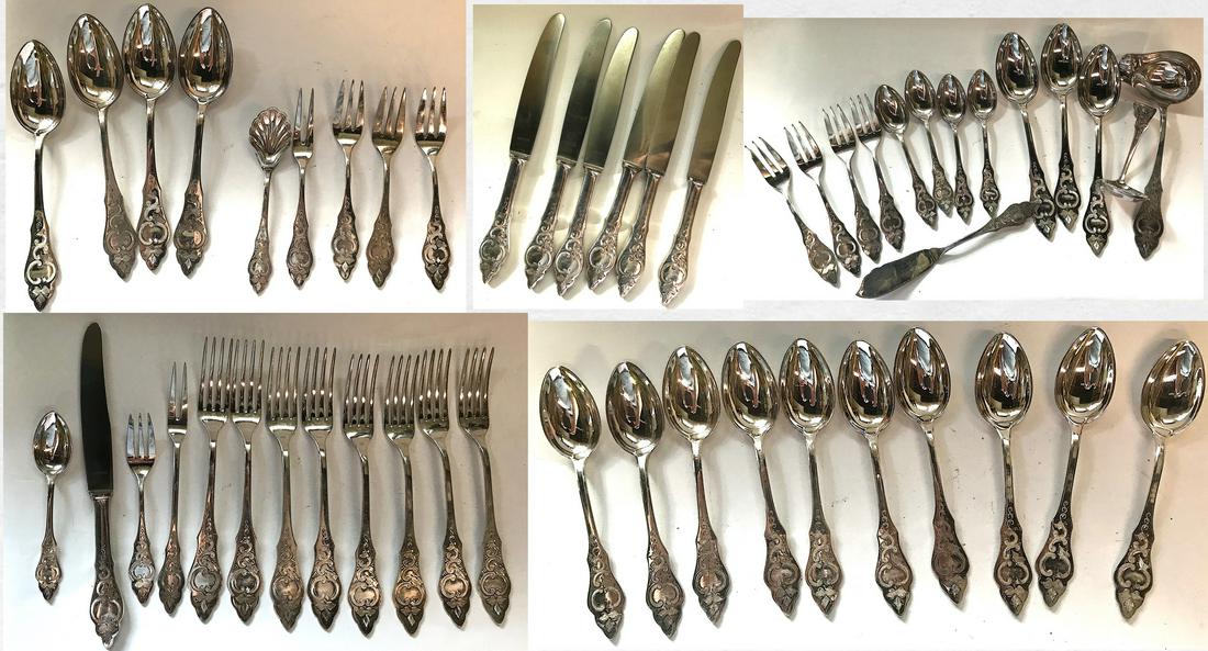 Antique German Silver Set Mkd Rostfrei (50): This early best quality brite cut engraved Rostfrei set is marked 90 and is comprised of eight dinner forks; seven knives; fifteen teaspoons; eight hors d-oeuvres forks; six large serving spoons; a sm