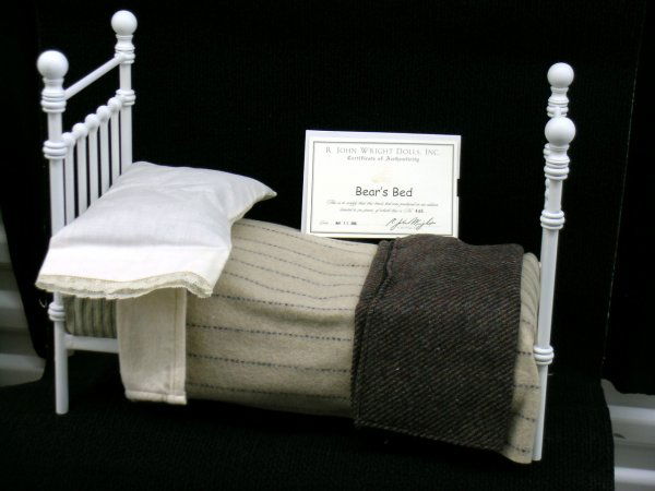 R. John Wright, Bear's Bed: Bear's Bed, 8"W x 15"L x 12"H, painted iron bed with assorted bedding. 1999. Limited Edition 500. Original issue price: $350.