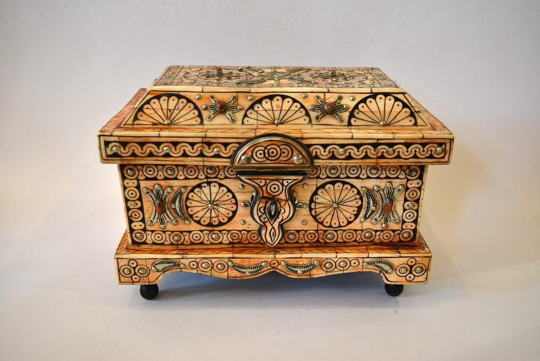Fine Moroccan Inlaid Chest: Intricately designed inlaid Moroccan chest. Hand wrought silver and stone decoration. Painted leather backing and turned wood feet; 9.5in.H. x 13in.W. x 8in.D.