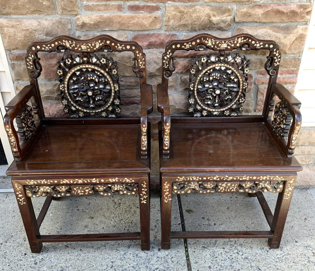 Pair of Chinese Inlaid Rosewood Throne Chairs: Pair of very fine carved rosewood throne chairs. Intricately inlaid with mother-of-pearl. Panelled seats on four square-section supports. Late Qing Dynasty c.1910;