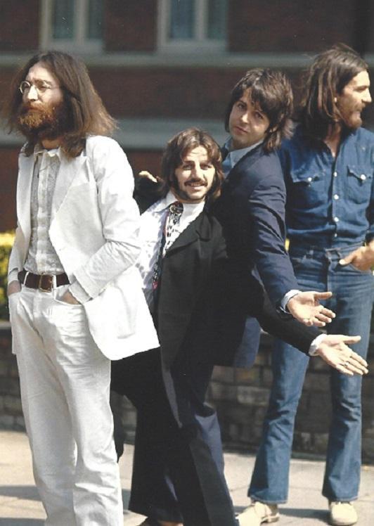 The Beatles Abbey Road Linda McCartney Photo: Original Publication Photo, measuring approximately, 7.5"x7.5" includes white border. Taken in 1969, printed 1998. It comes stamped by the photographer and agency. The photograph is printed on double 